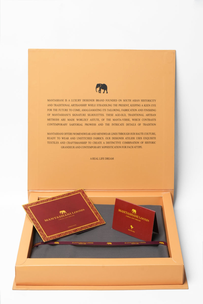Manish Arora branded box with cards on a white background